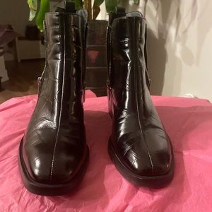 3.1 Phillip Lim - Black leather ankle boots with side zippers on both sides.